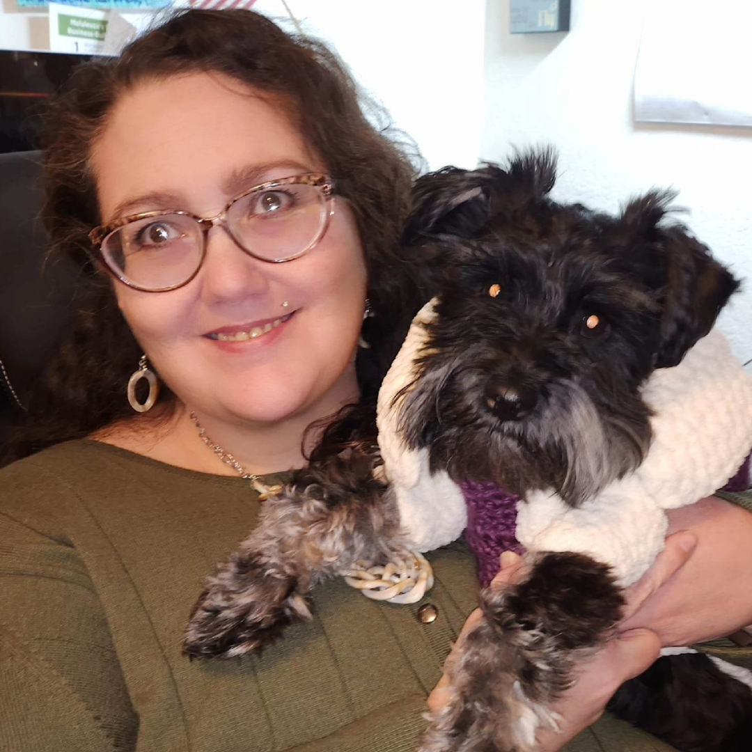 Owner of Anchored Virtual Assisting with her miniature Schnauzer, lovingly dubbed the PetExecutive Officer.