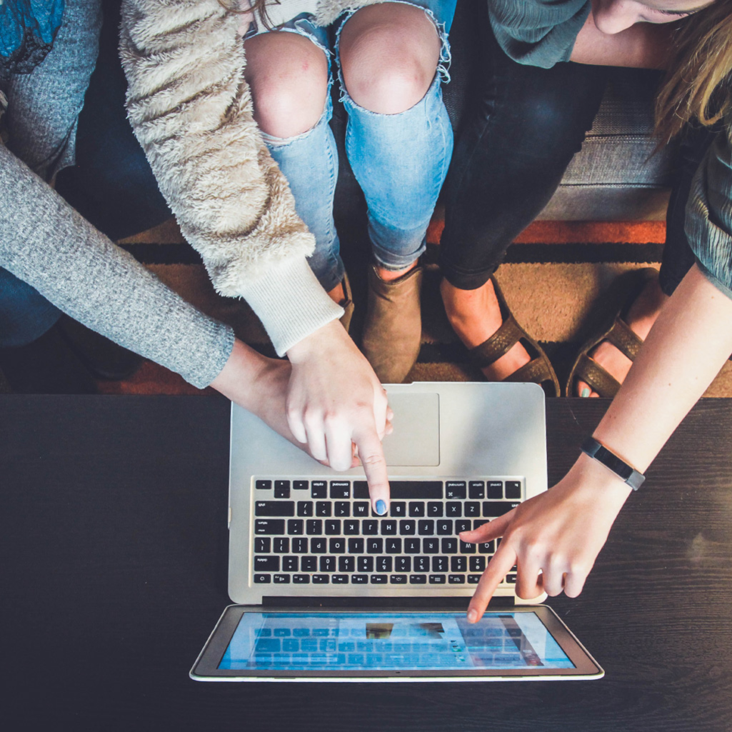 People around a laptop, decorative